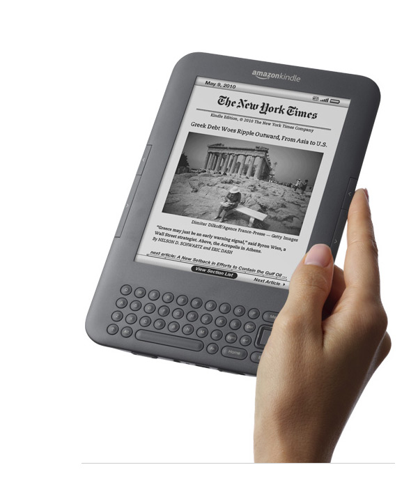 Large photo of Amazon Kindle 3 in female hand - Gray