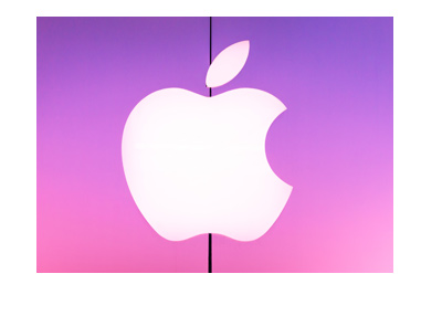 Apple - Real life company logo on purple-pink background.  Store front.  Year is 2018.