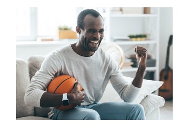 The basketball fan cheering at the news of the potential of legalizing of sports betting in the United States.