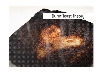 The Burnt Toast Theory explained.  What is it?  In photo:  Blackened piece of bread.