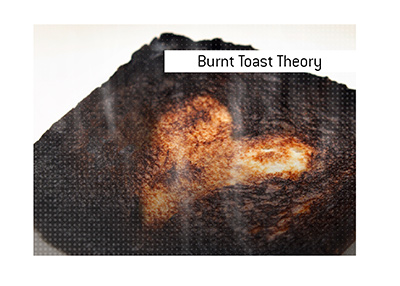 The Burnt Toast Theory explained. What is it? In photo: Blackened piece of bread.