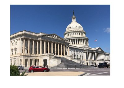 The Capitol Hill building - Washington D.C. - United States of America - Street view on a sunny day.