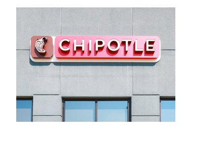 The Chipotle store front. Logo on concrete building. Year is 2017.