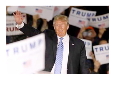 Donald Trump among his supporters.  Hand raised in the air. - December 2015