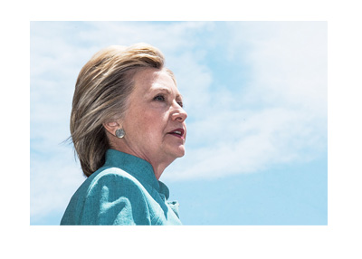 Hillary Clinton 2016 campaign photo. Blue dress, looking up into the blue sky.