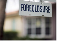 -- home foreclosure sign - hanging in front of a home --