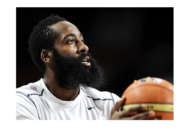 Basketball player, James Harden, taking a shot.  Full focus.