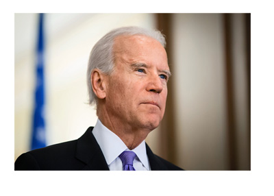 Vice president Joe Biden wearing a purple tie and gazing into the cameras