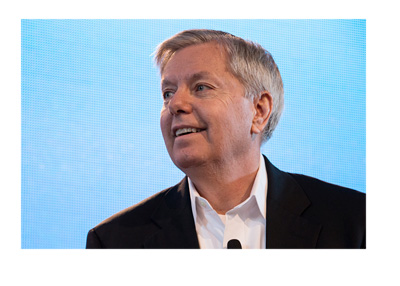 The South Carolina senator - Lindsey Graham - In front of a light blue LCD screen