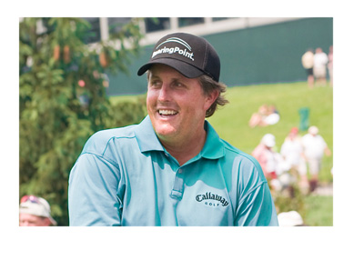 Photo of golfer Phil Mickelson on the golf course.  Big smile on his face.