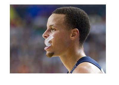 Stephen Curry - Star basketball player - Mouth-guard hanging outside of the mouth.