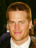 Tom Brady at a public event wearing a suit