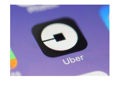 Uber app pictured on a smartphone, surrounded by other apps.