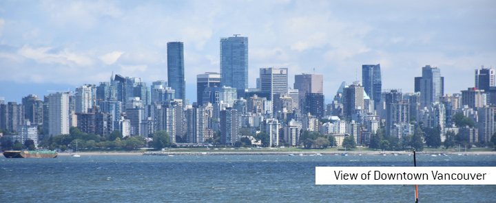 The view of downtown Vancouver from Jericho Beach.  The year is 2019 and the month is May.