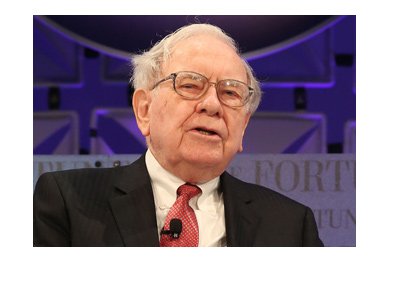 Warren Buffett is photographed during an interview. Purple lighting is in the background.