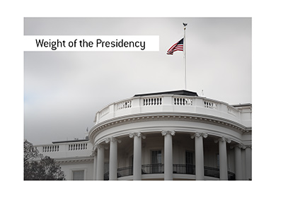 American flag at half-staff above the South Portico of the White House under an overcast sky.