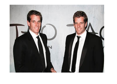 The Winklevoss twins dressed up for a night out. Photographed wearing black suits and bow ties.